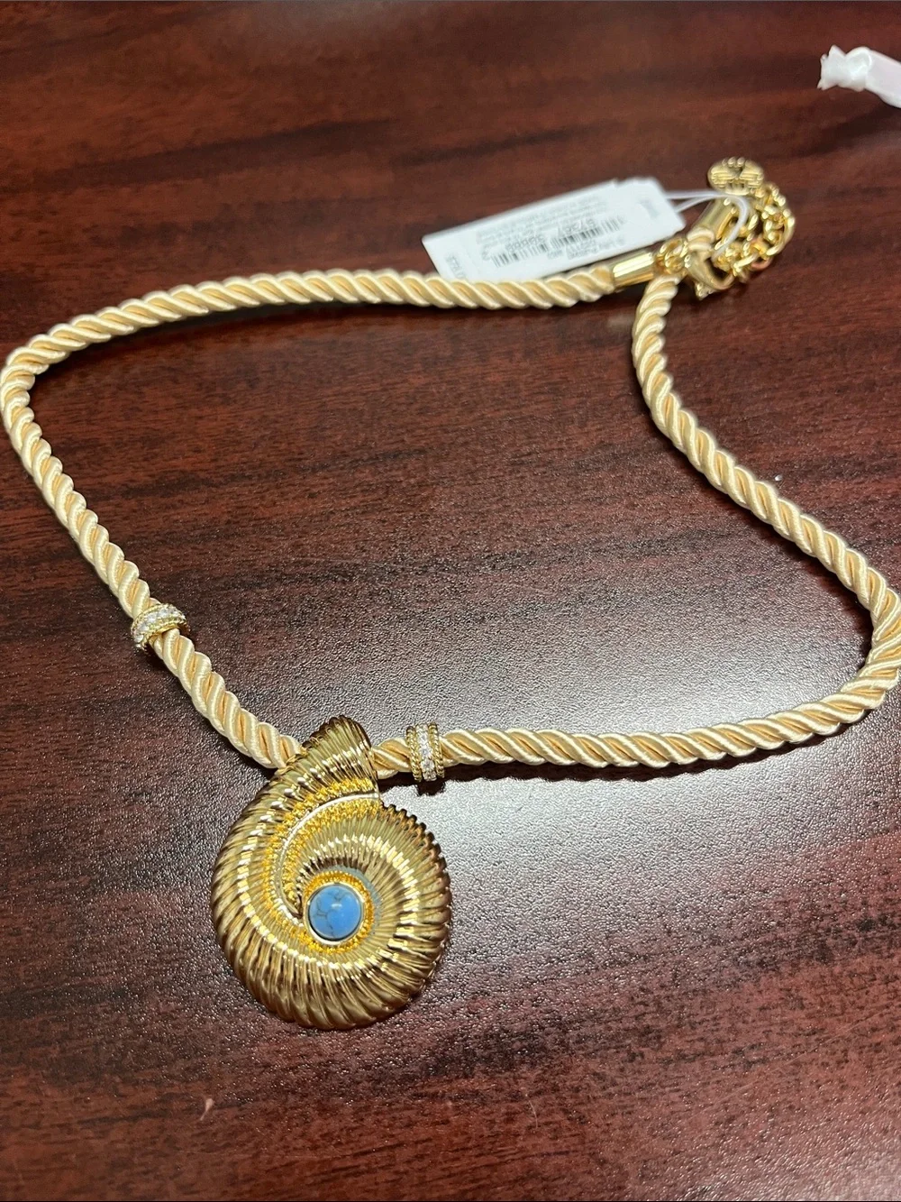 Lilly Pulitzer gold shell with blue stone! Gold cord with accents. Beautiful.